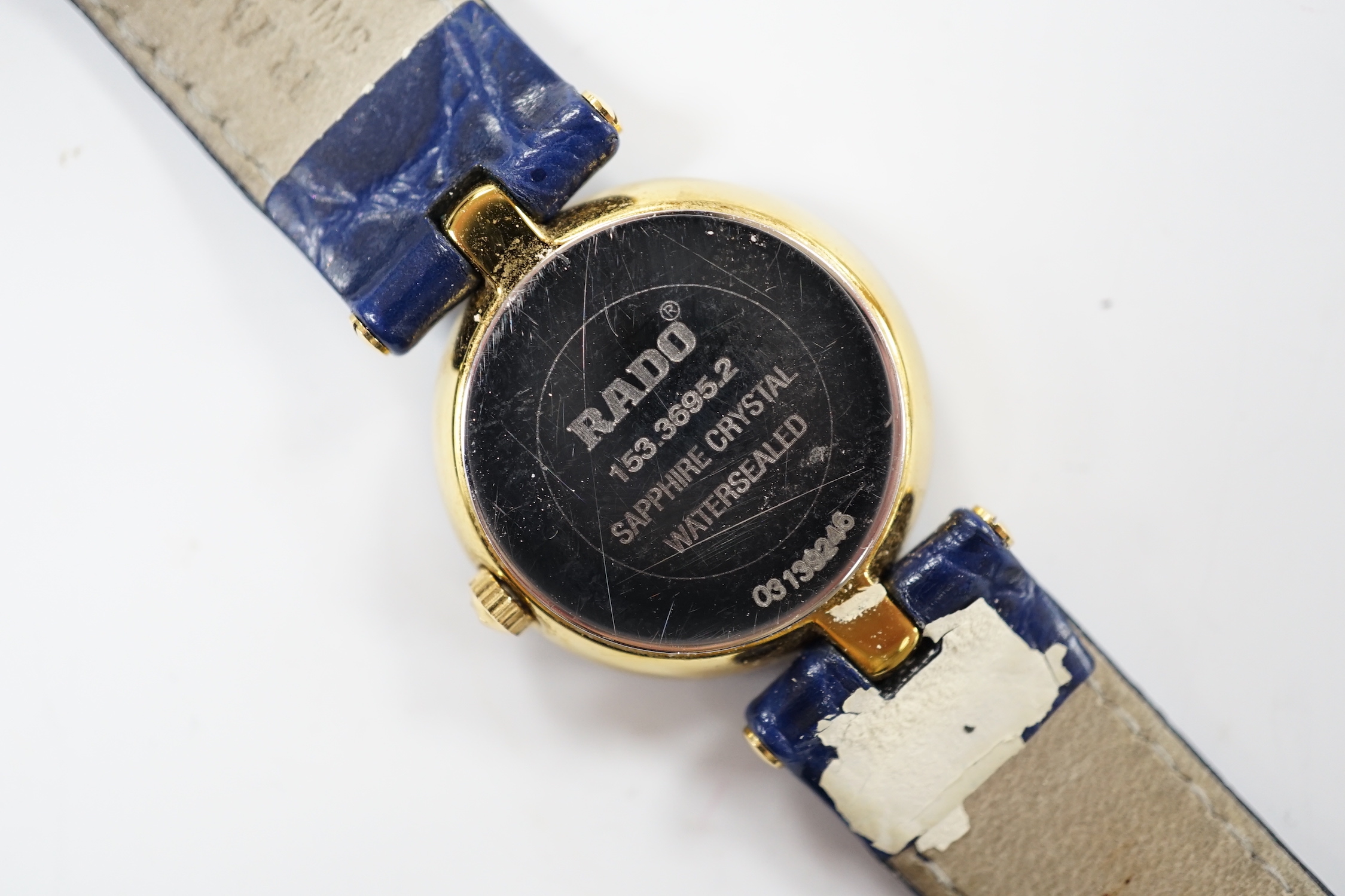 A lady's modern steel and gold plated Rado Jubilé quartz wrist watch, Rado strap and spare black Rado strap, with Rado box.